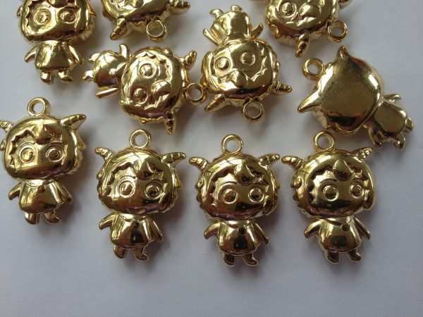10 Gold girl charms/pendants